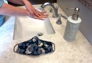 washing hands in sink