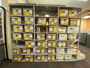 Records boxes on shelves in the BCIT Archives