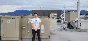 Edward Beckett, Kitslano Secondary School in front of a heat recovery unit