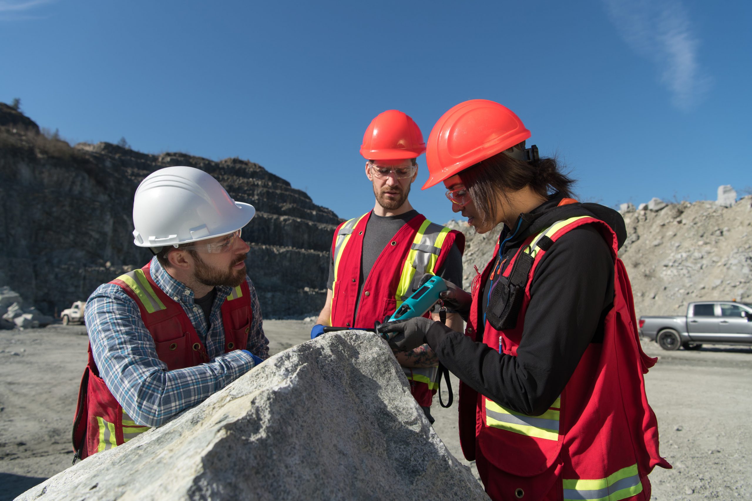 BCIT instructor guides students in field work at an operating mining facility