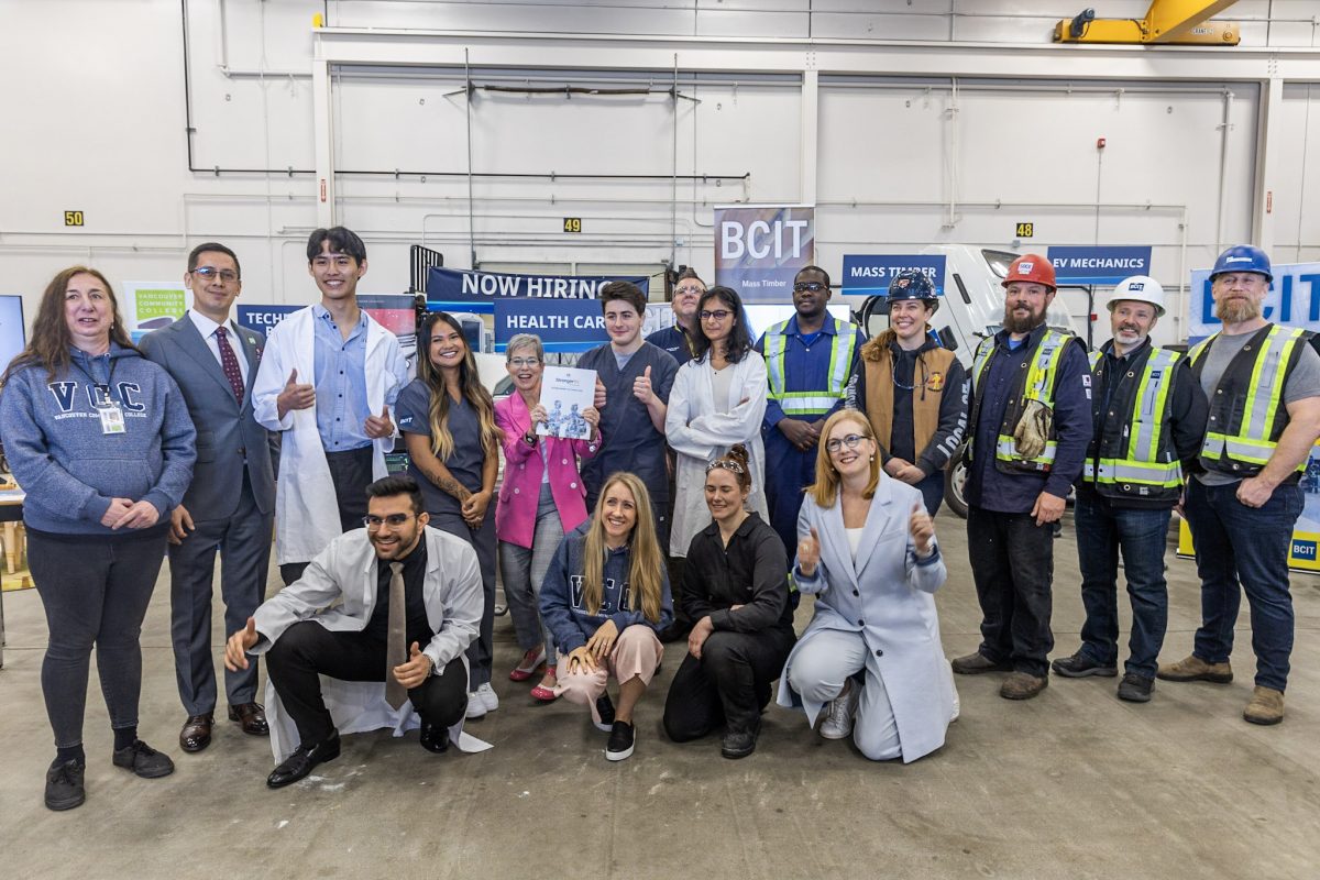 A group of people stand together for a photo at the BCIT Annacis Island Campus.