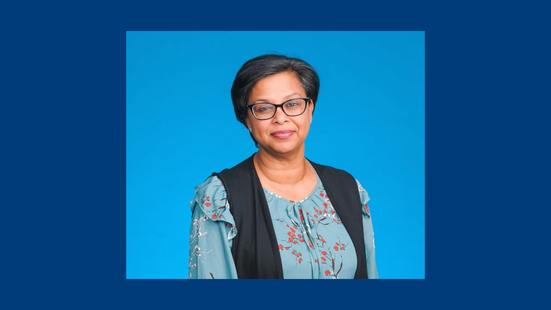 Nitasha Naiker, Program Head, BCIT Accounting and Finance Diplomas headshot on a blue background.