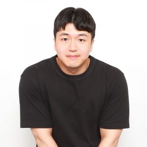A headshot picture of David (Yu) Kim wearing a black shirt