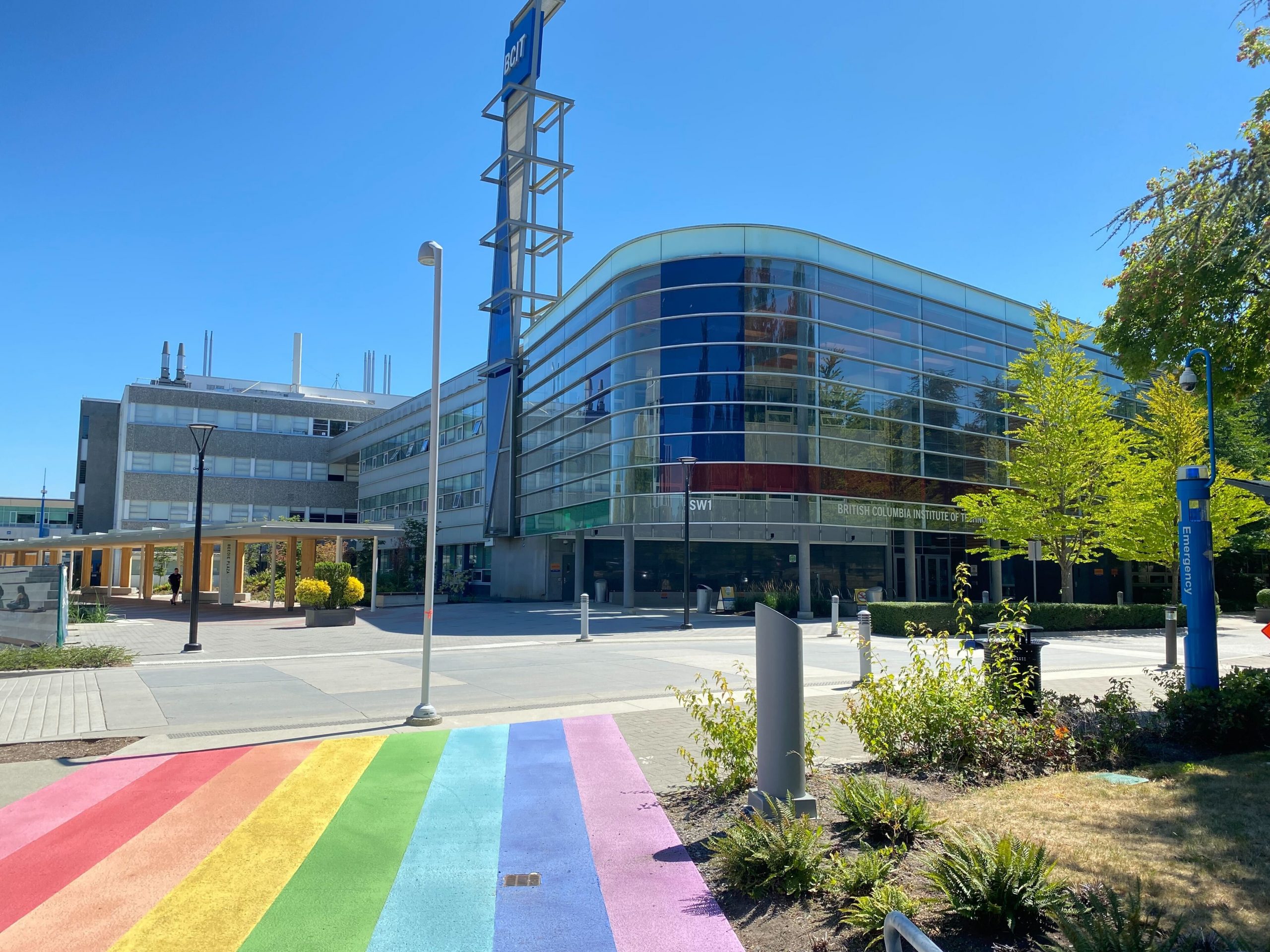 BCIT building with a rainbow crosswalk