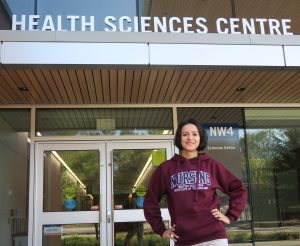 BCIT Nursing student Tamara stands in front of the Health Sciences Centre